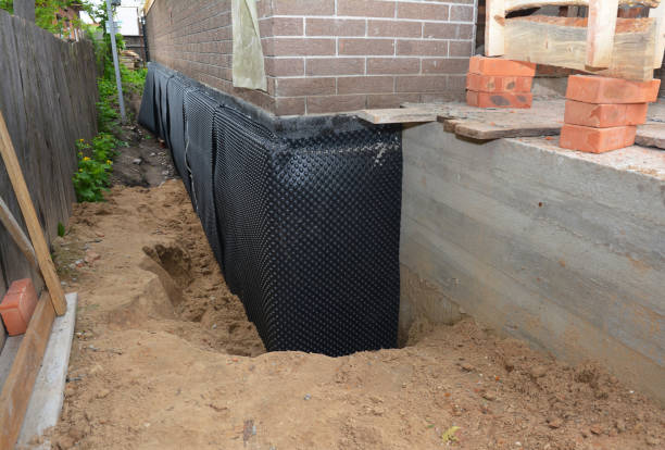 Happy homeowners after waterproofing job in Bluff City
